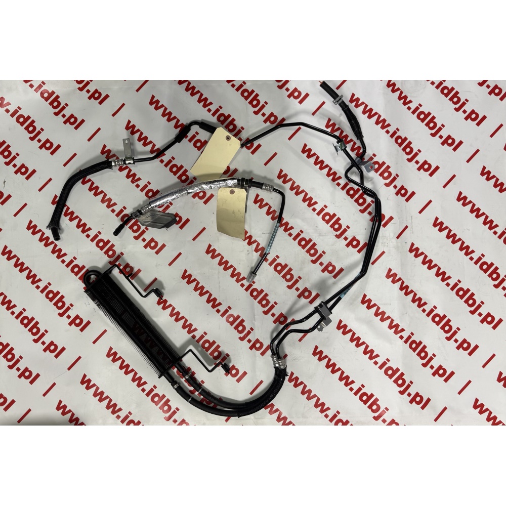 Fotografia produktu FIAT ORK04717384AB CHŁODNICA, PŁYNU WSPOMAGANIA FIAT FREEMONT, DODGE DURANGO Przewód wspomagania układu kierowniczego w formie spirali.